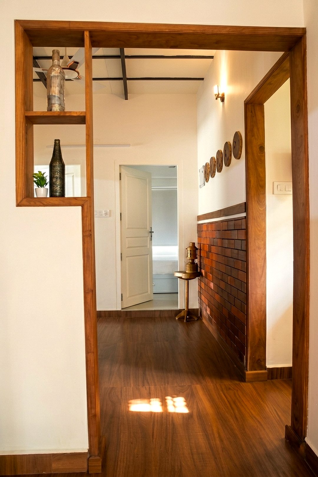 Wooden doorway opening onto the corridor to the bedrooms